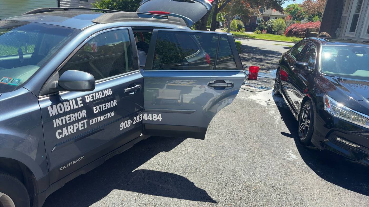 JARO Detailing vehicle with Interior, Exterior and Carpet Extraction lettering and phone number